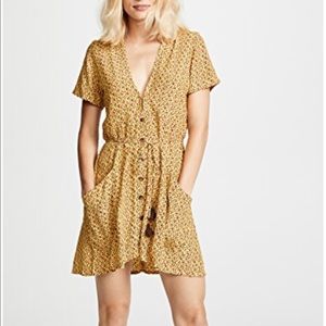 Faithfull the brand yellow floral dress.